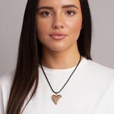 Revere gold heart pendant necklace with black cord, imported from the UK