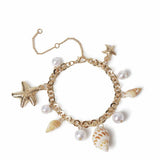 Argos Freedom Gold Tone Pearl Shell and Metal Charm Bracelet 19cm- Buy online at McGrocer