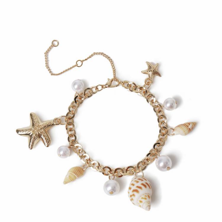 Freedom gold tone pearl shell charm bracelet, UK version