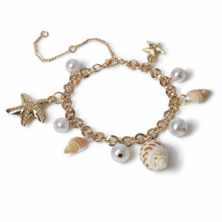 Freedom gold tone pearl shell charm bracelet, UK version