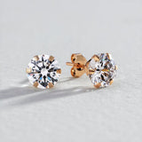 Revere 9ct gold cubic zirconia stud earrings, imported from the UK