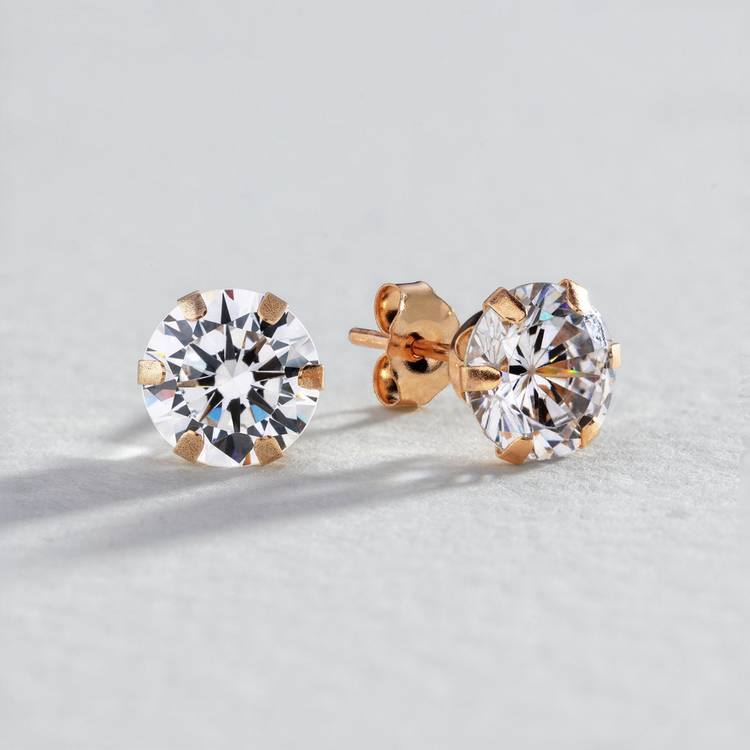 Revere 9ct gold cubic zirconia stud earrings, imported from the UK