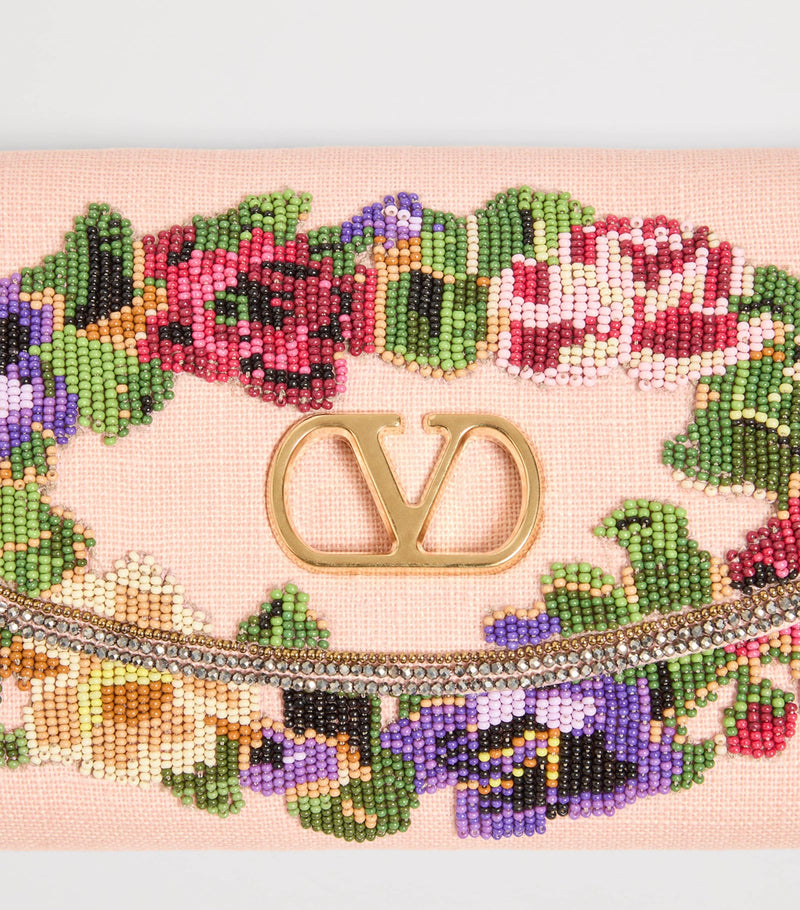 Valentino Garavani small beaded DeVain shoulder bag, imported from the UK