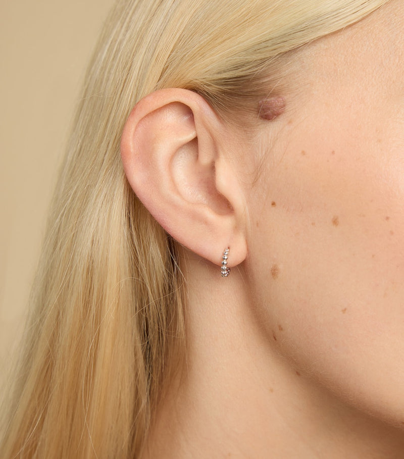 Astrid & Miyu white gold heart huggie earrings (British brand)