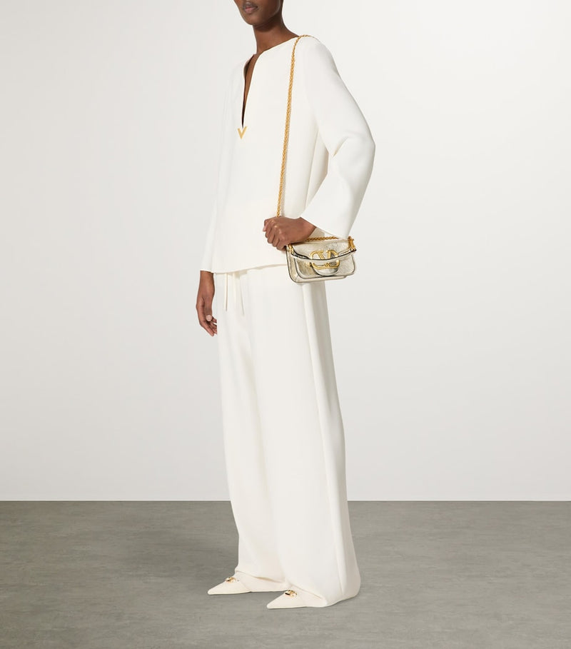 Valentino Garavani small leather Locò shoulder bag, imported from the UK