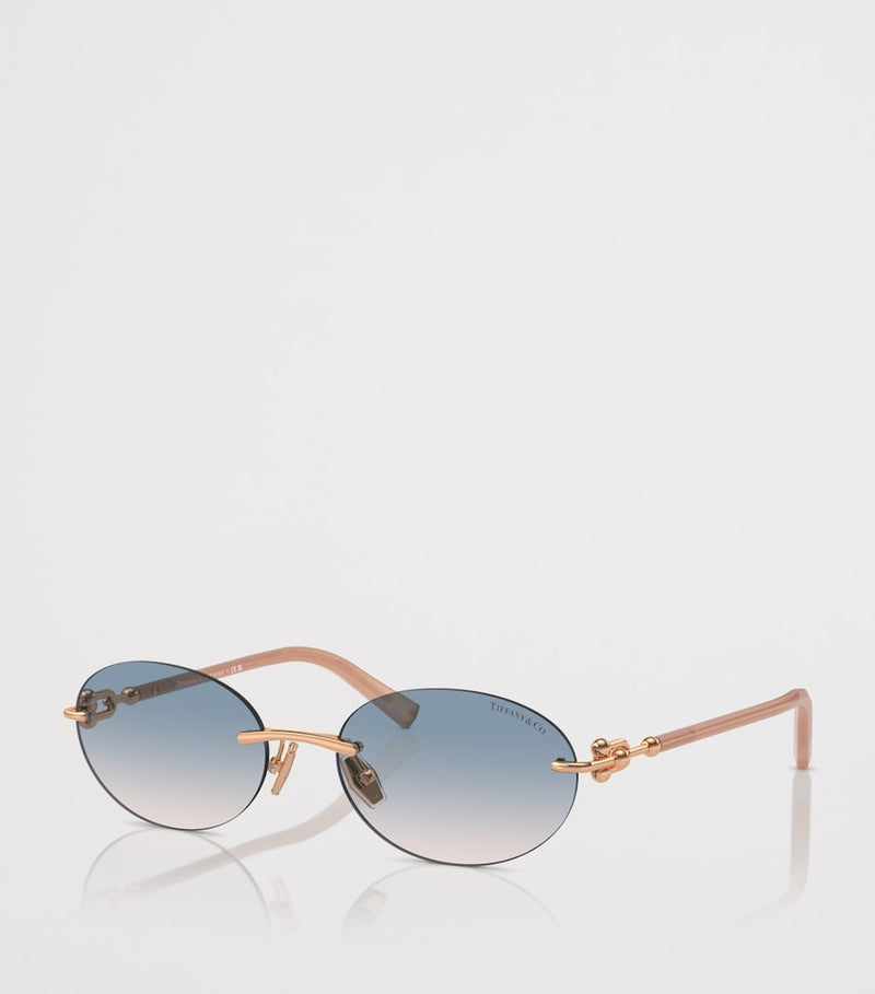 Tiffany & Co. rimless oval sunglasses with gold-tone temples, UK version