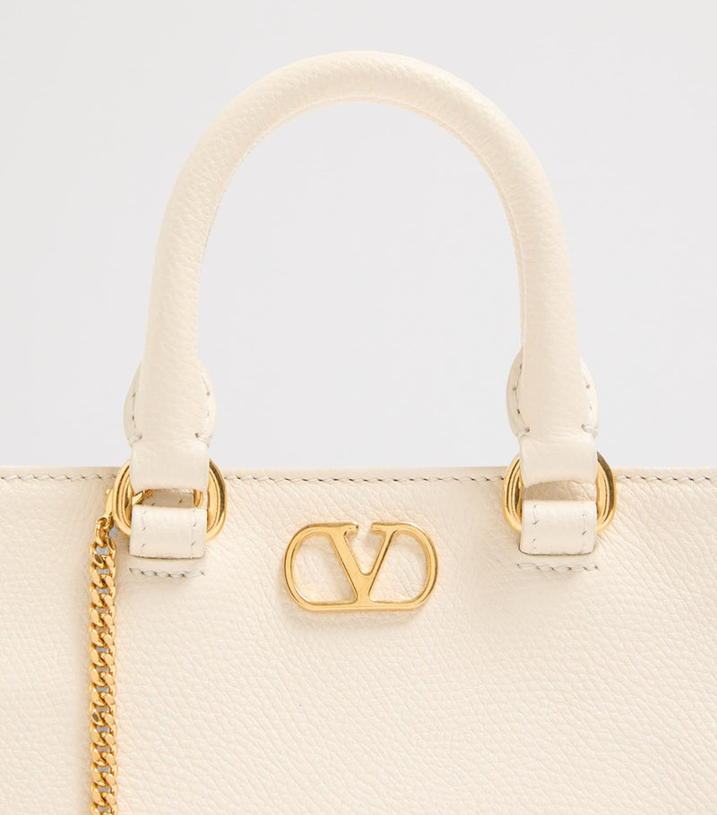 Valentino Garavani VLogo Mini top-handle bag in grained leather (British brand)