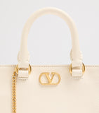 Valentino Garavani VLogo Mini top-handle bag in grained leather (British brand)