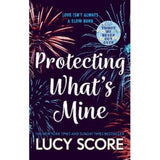 Protecting What's Mine paperback romance novel by Lucy Score, UK version