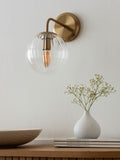 Brass Bourton wall light with swirl glass shade, imported from the UK