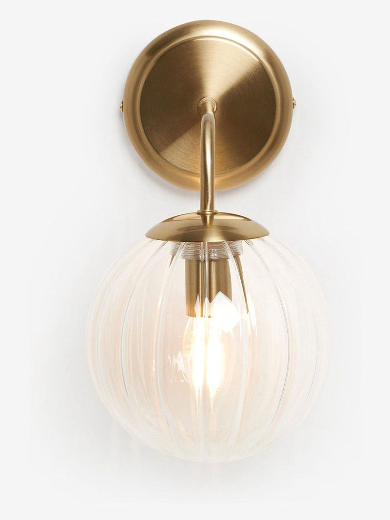 Brass Bourton wall light with swirl glass shade, imported from the UK