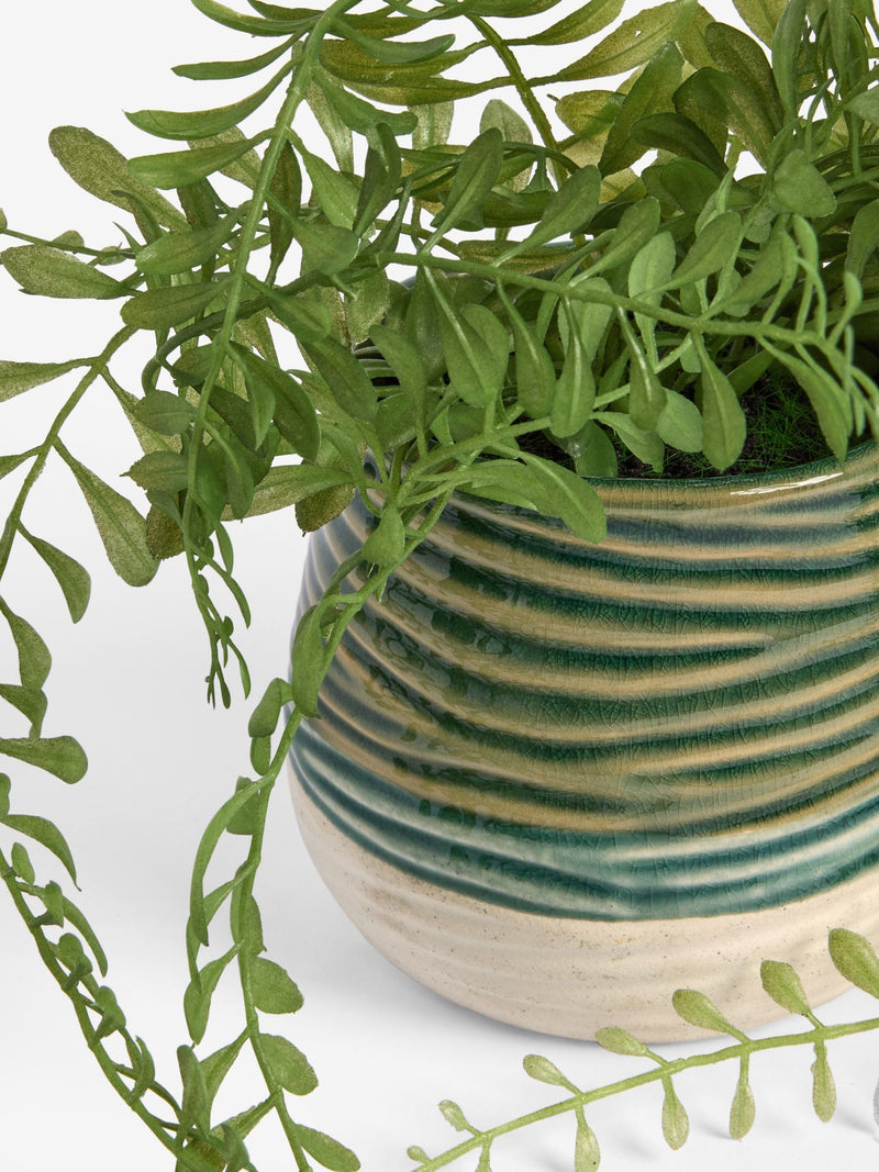 Green artificial trailing plant in reactive ceramic pot, 33cm height, UK version