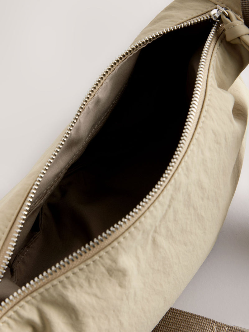 Stone sling bag with adjustable strap, imported from the UK