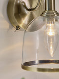 Gloucester wall light with clear glass and brass accents, UK version