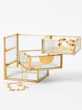 Oliver Bonas gold glass swivel tiered jewellery box, imported from the UK