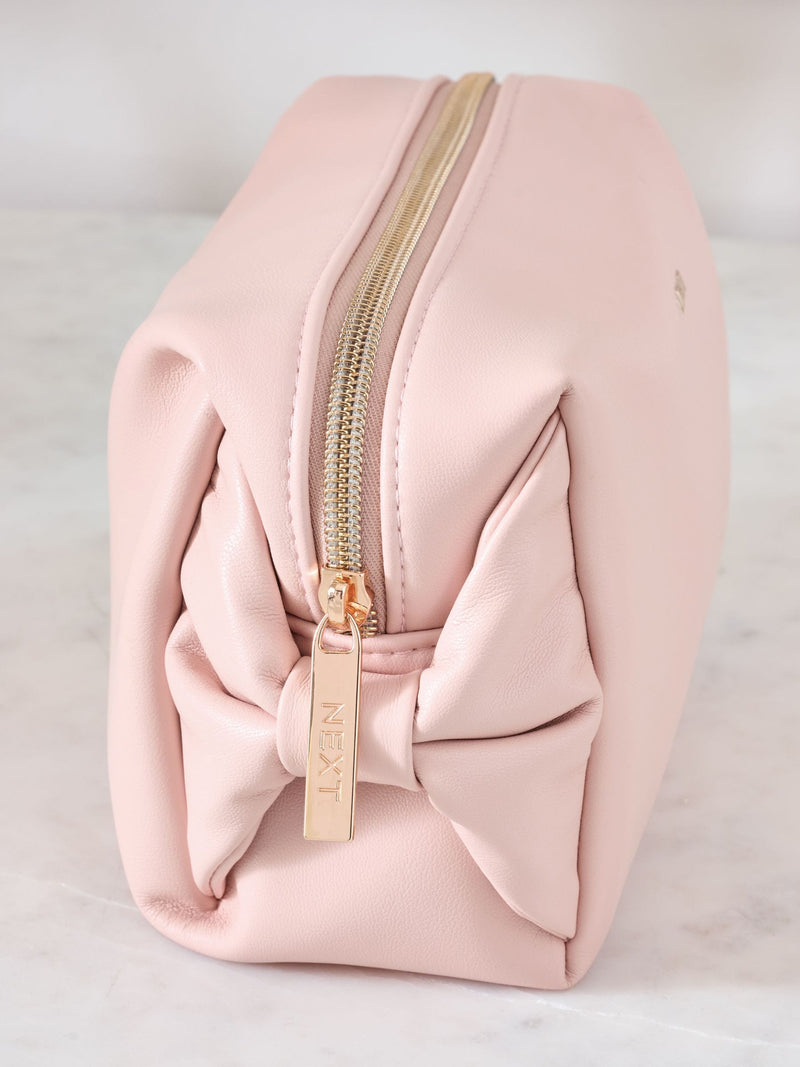 Pink faux leather bow detail makeup bag, imported from the UK