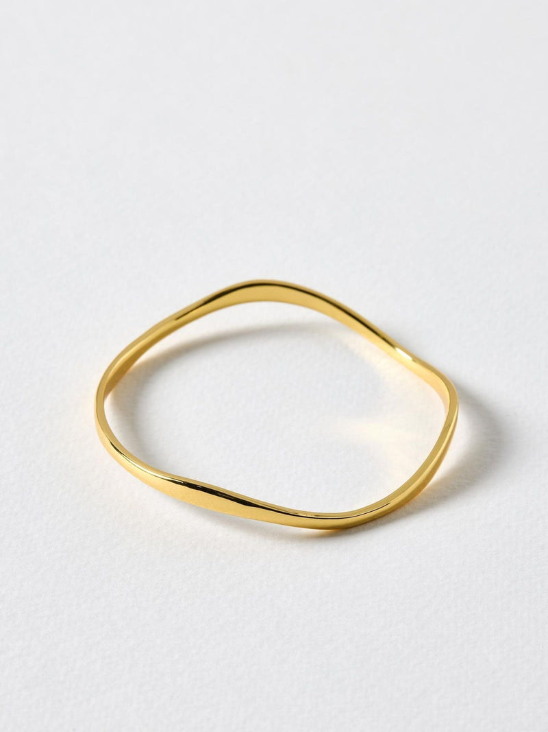 Oliver Bonas Gold Tone Naia Ripple Wave bangle, imported from the UK