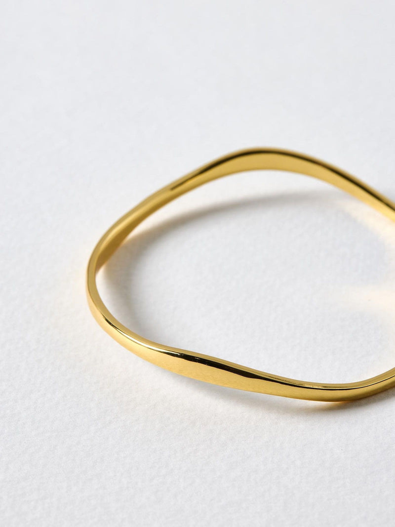 Oliver Bonas Gold Tone Naia Ripple Wave bangle, imported from the UK