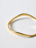 Oliver Bonas Gold Tone Naia Ripple Wave bangle, imported from the UK