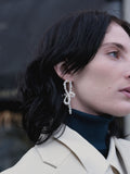 CompletedWorks loop-the-loop pearl earrings, UK version