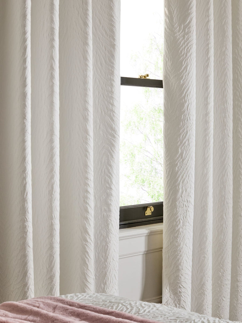 Cream embossed animal texture blackout eyelet curtains, UK version