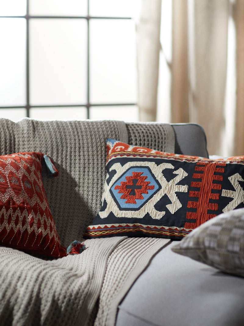 John Lewis Kuva velvet bolster cushion with embroidery and tassels in Red Brick, UK version