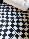 Rockett St George black checkerboard diamond tufted rug (British brand)