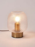 Oliver Bonas table lantern with textured glass shade and brass base, imported from the UK