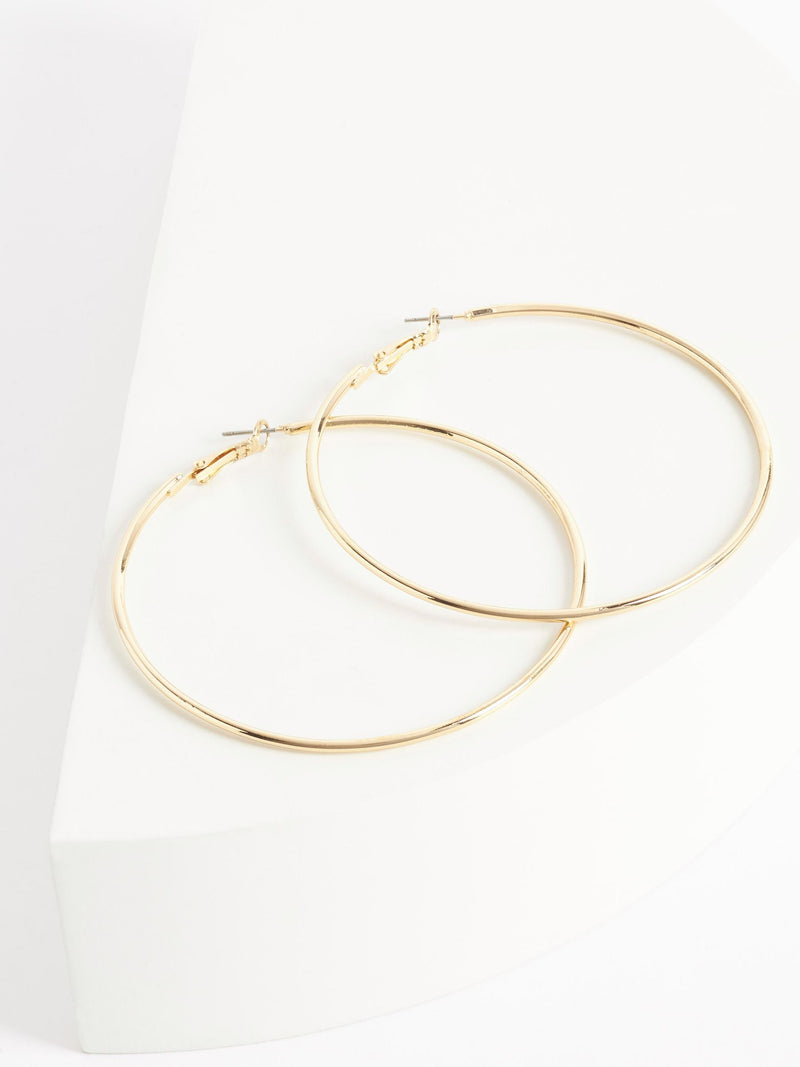 Gold tone oversized hoop earrings, UK version