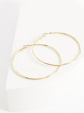 Gold tone oversized hoop earrings, UK version
