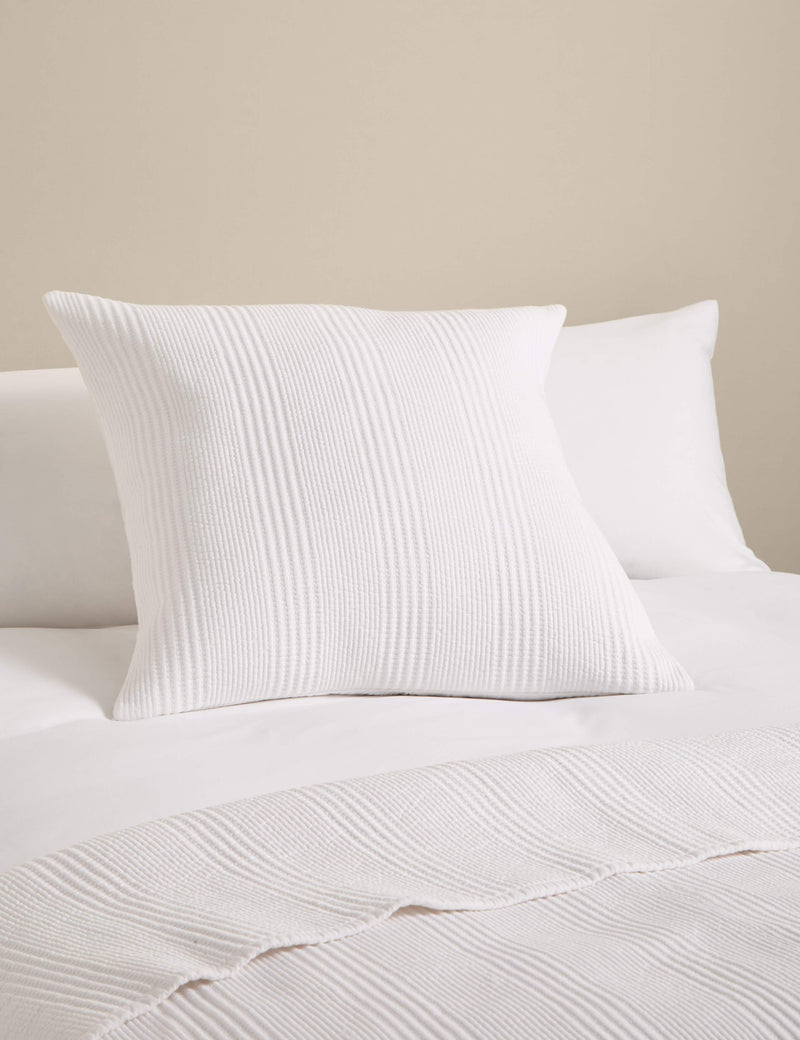 Decorative cushion with cotton rich fabric and striped design (British brand)