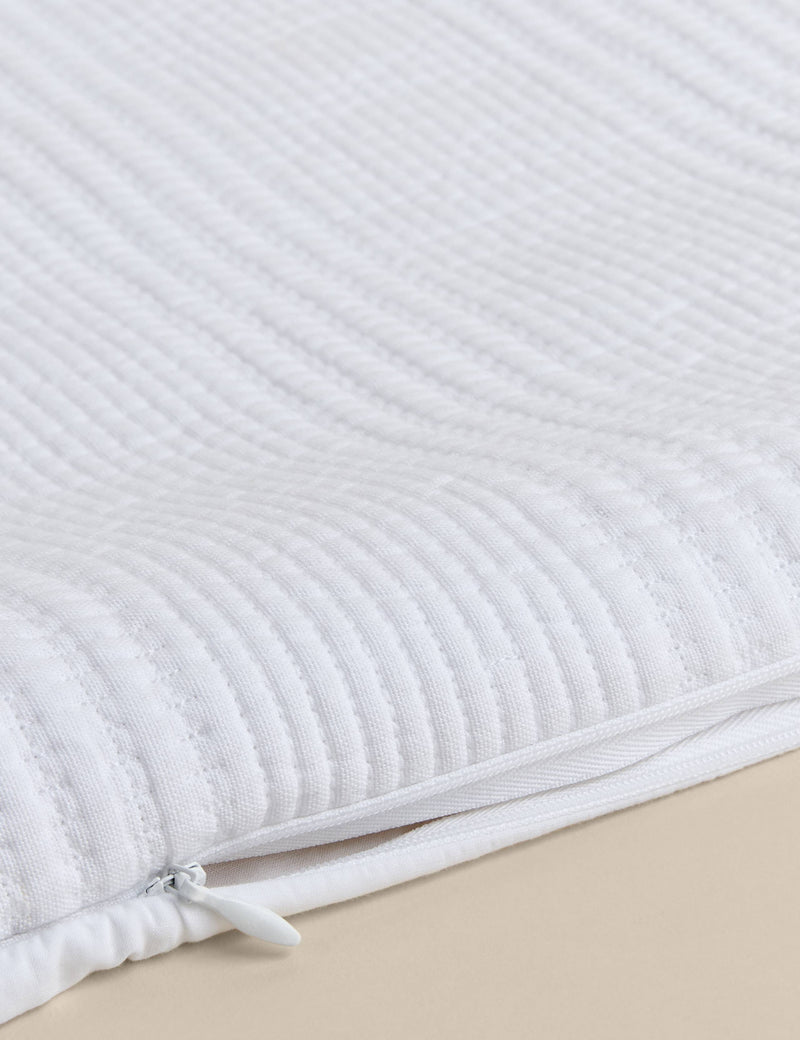 Decorative cushion with cotton rich fabric and striped design (British brand)