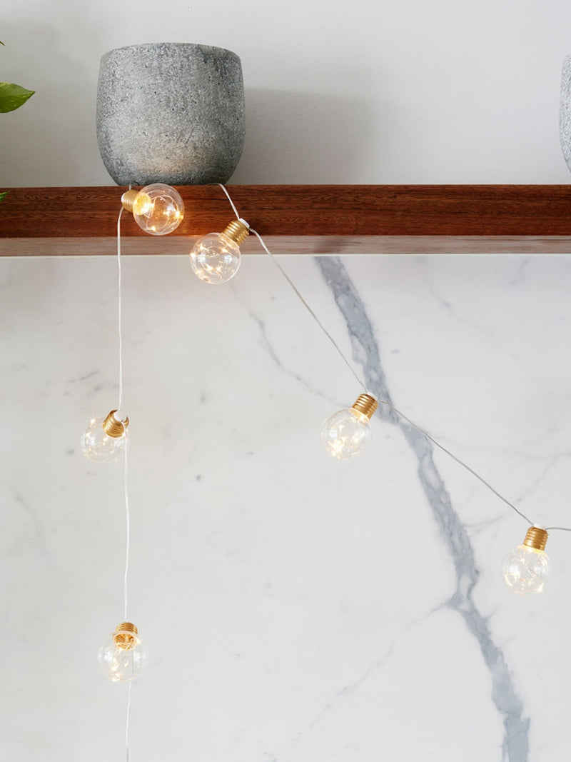 Lights4fun brass micro fairy light festoon, imported from the UK