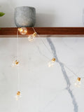 Lights4fun brass micro fairy light festoon, imported from the UK