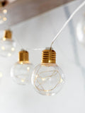 Lights4fun brass micro fairy light festoon, imported from the UK