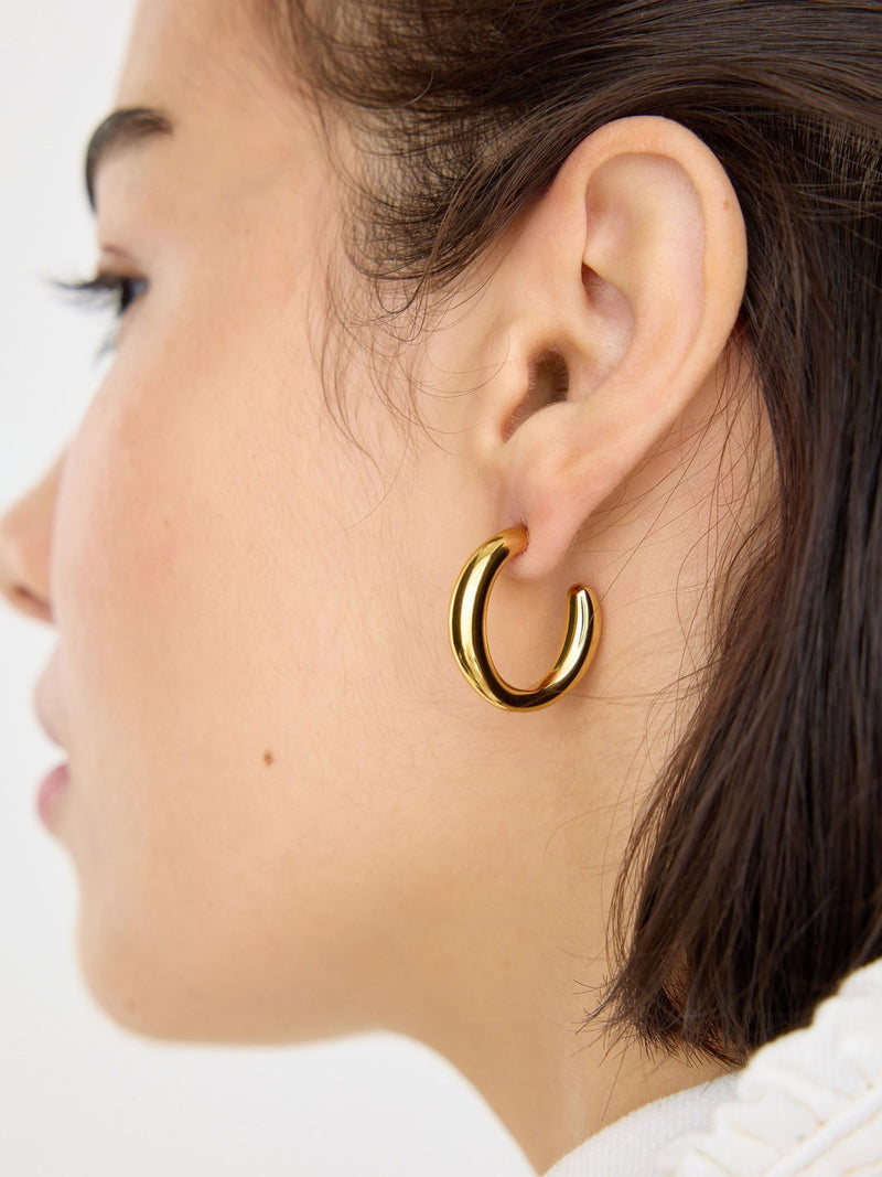Oliver Bonas gold tone waterproof chunky hoop earrings, imported from the UK