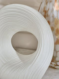 White pleated stoneware ornament with abstract shape (British brand)