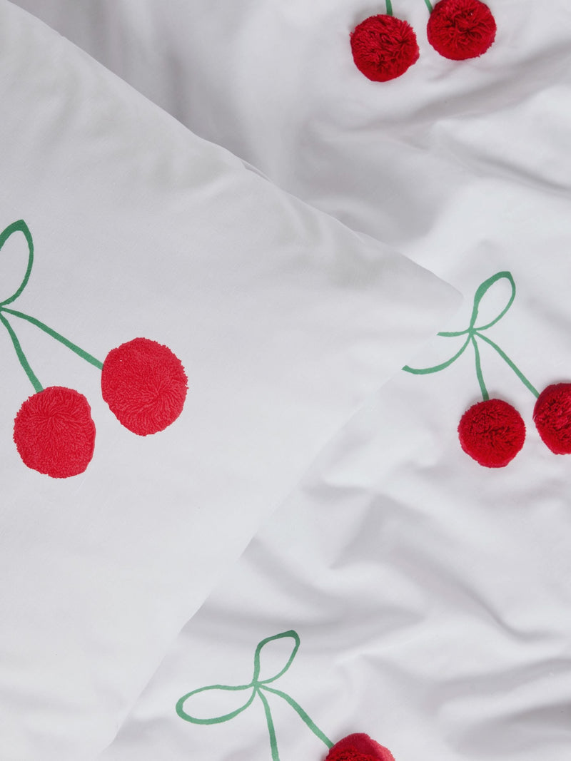 Red Cherry Poms printed polycotton duvet cover and pillowcase set, imported from the UK