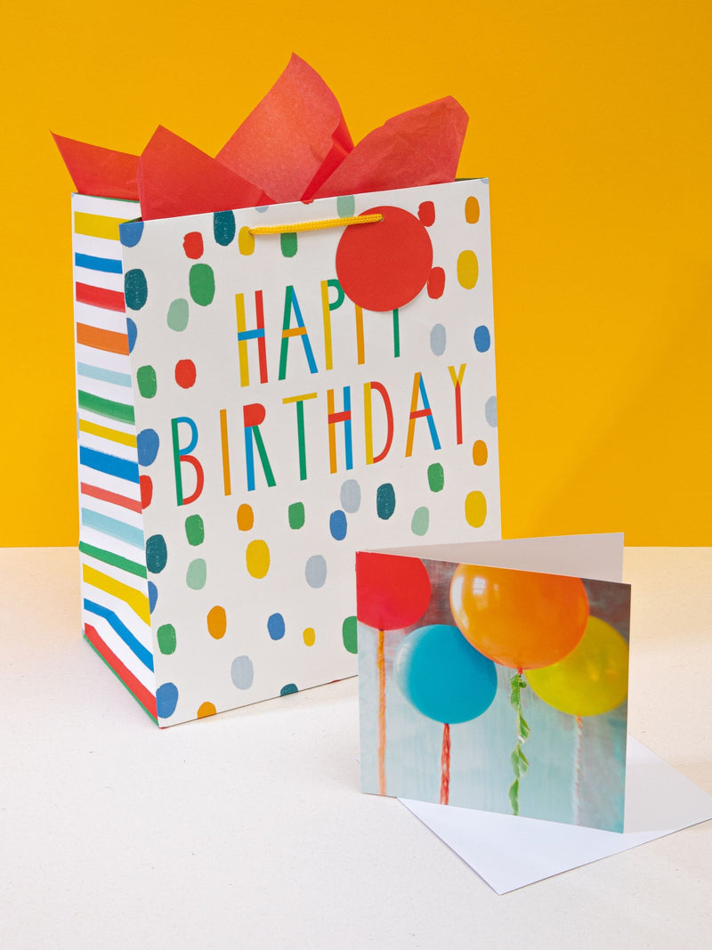 Hallmark birthday gift bag set with red tissue and card, UK version