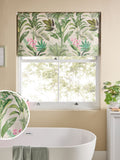 Tropical leaf print blackout roller blind in green and pink, UK version