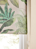 Tropical leaf print blackout roller blind in green and pink, UK version