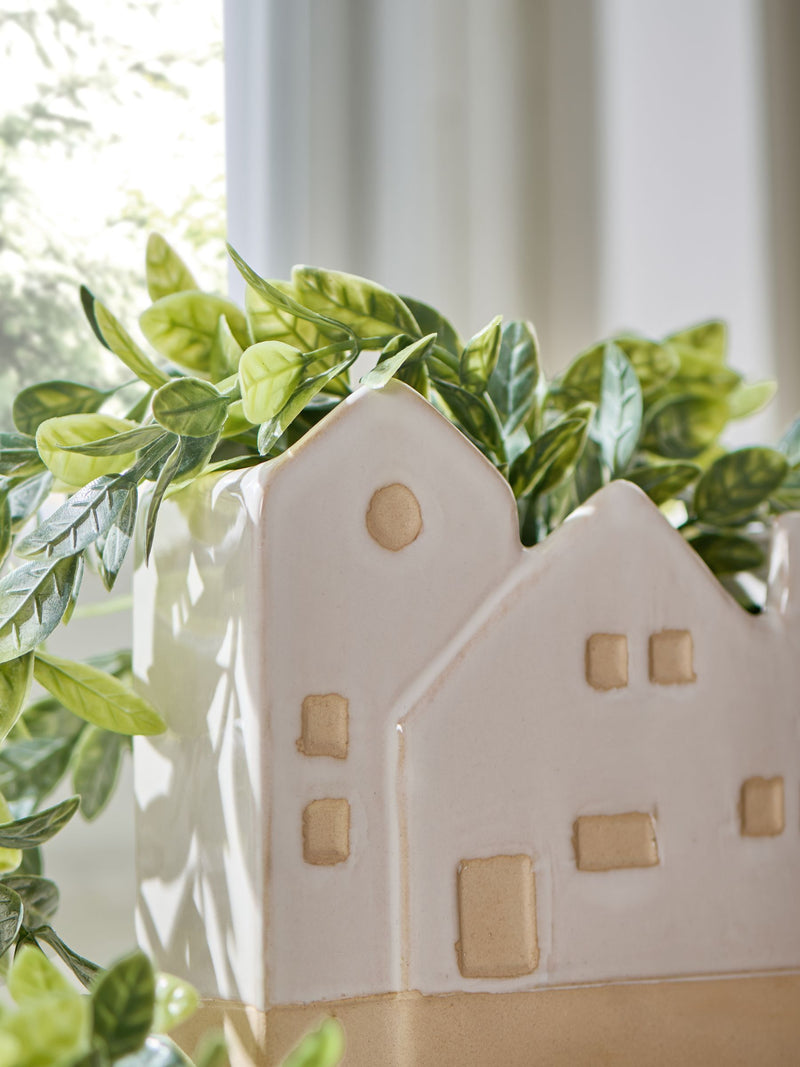 Artificial trailing plant in ceramic house shaped pot - British product