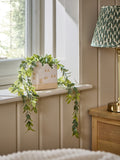 Artificial trailing plant in ceramic house shaped pot - British product