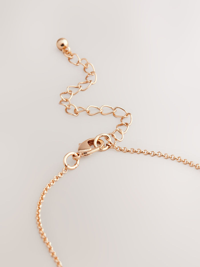 Gold tone mother of pearl octagon necklace, UK version