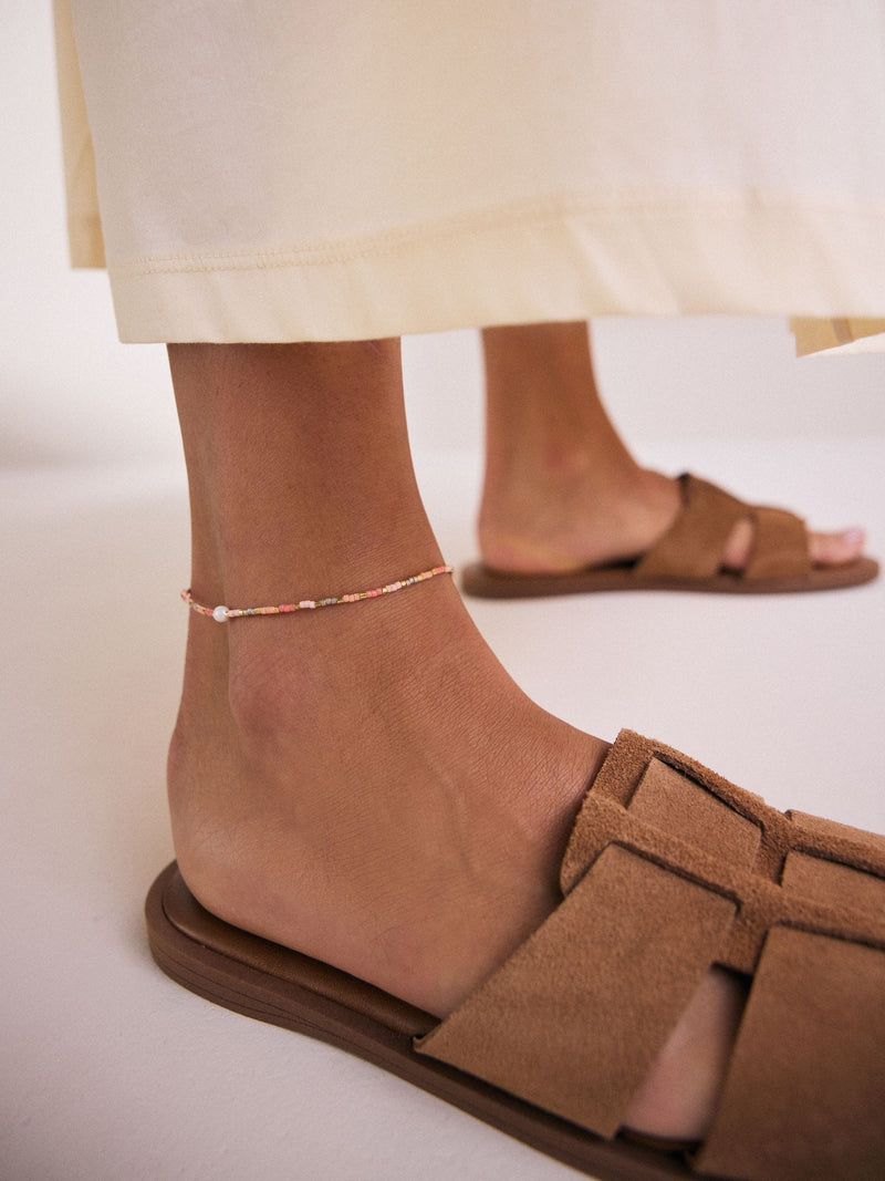 Orange beaded anklet, imported from the UK