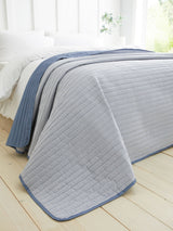 Next Catherine Lansfield Chambray Blue Stripe Quilted Reversible Bedspread - 220x230cm- Buy online at McGrocer