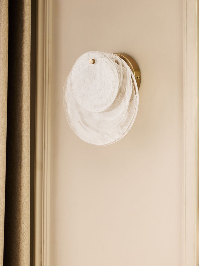 White Claremont wall light with brushed brass and opaque glass discs, imported from the UK