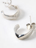 Oliver Bonas sterling silver huggie earrings with faceted surface, imported from the UK