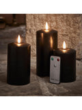Lights4fun black TruGlow LED pillar candle trio with 15cm, 12.5cm, and 10cm heights, UK version