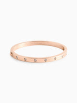 Kate Spade gullbesatt steinhengslet armbånd